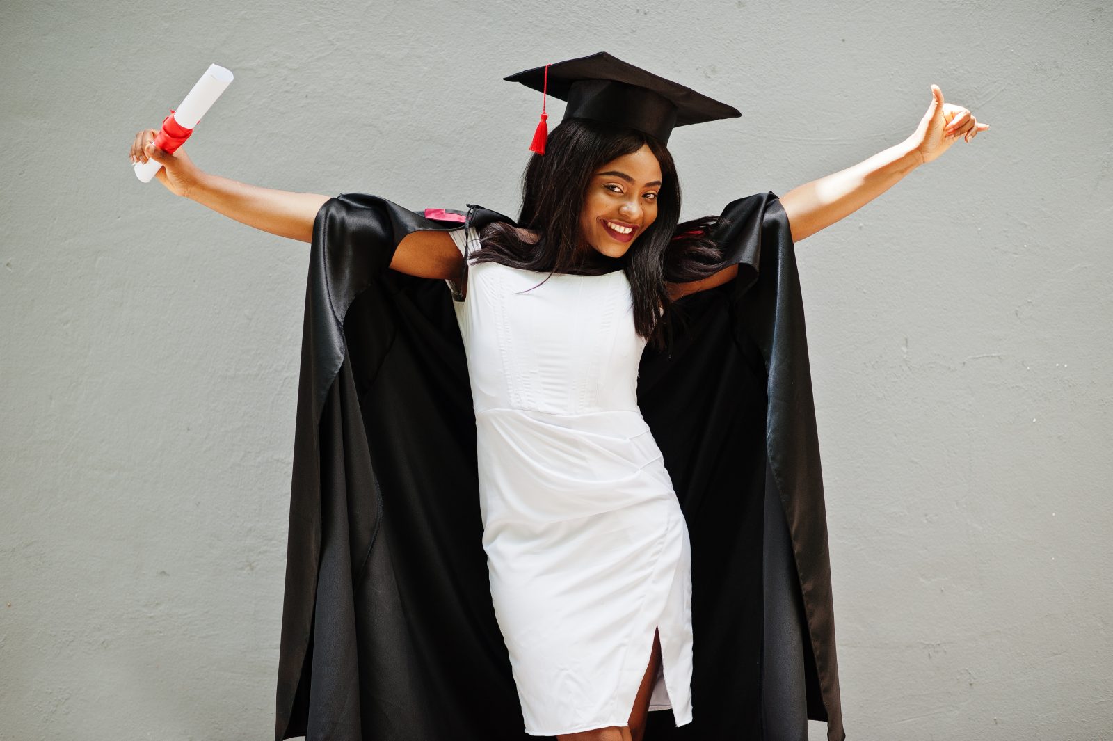 Excited graduate celebrating with her diploma